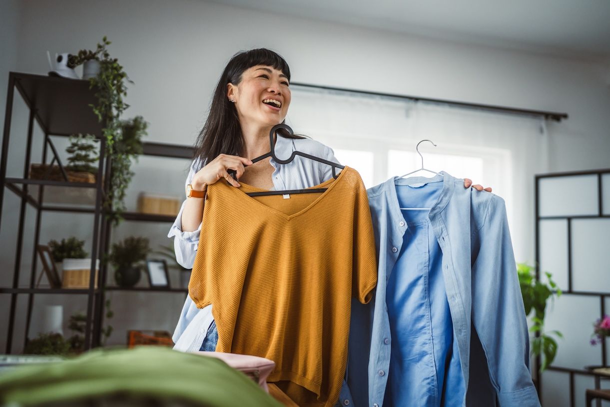 Woman hanging clean laundry with care – professional laundry service in Nashville for longer-lasting clothes